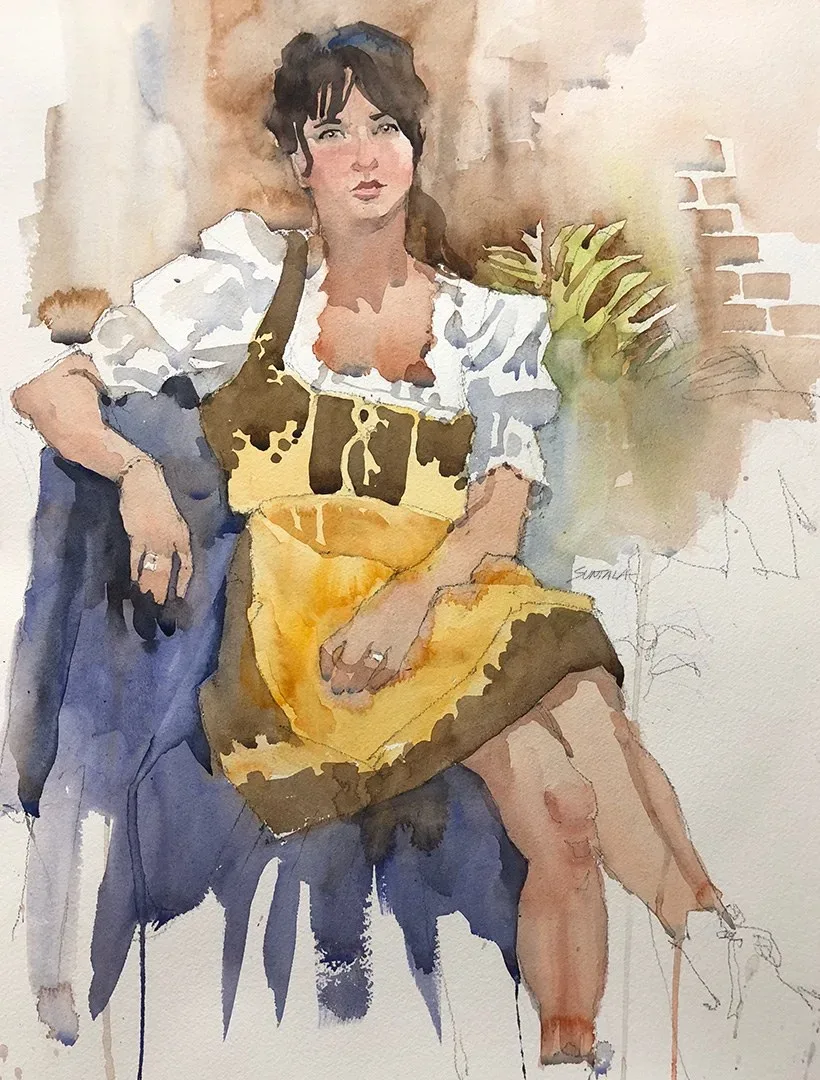 Seated woman in Oktoberfest dress.