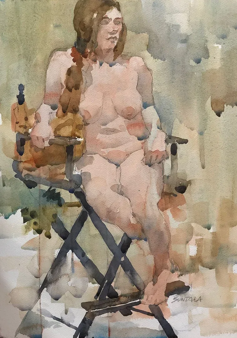 Nude woman seated in director's chair