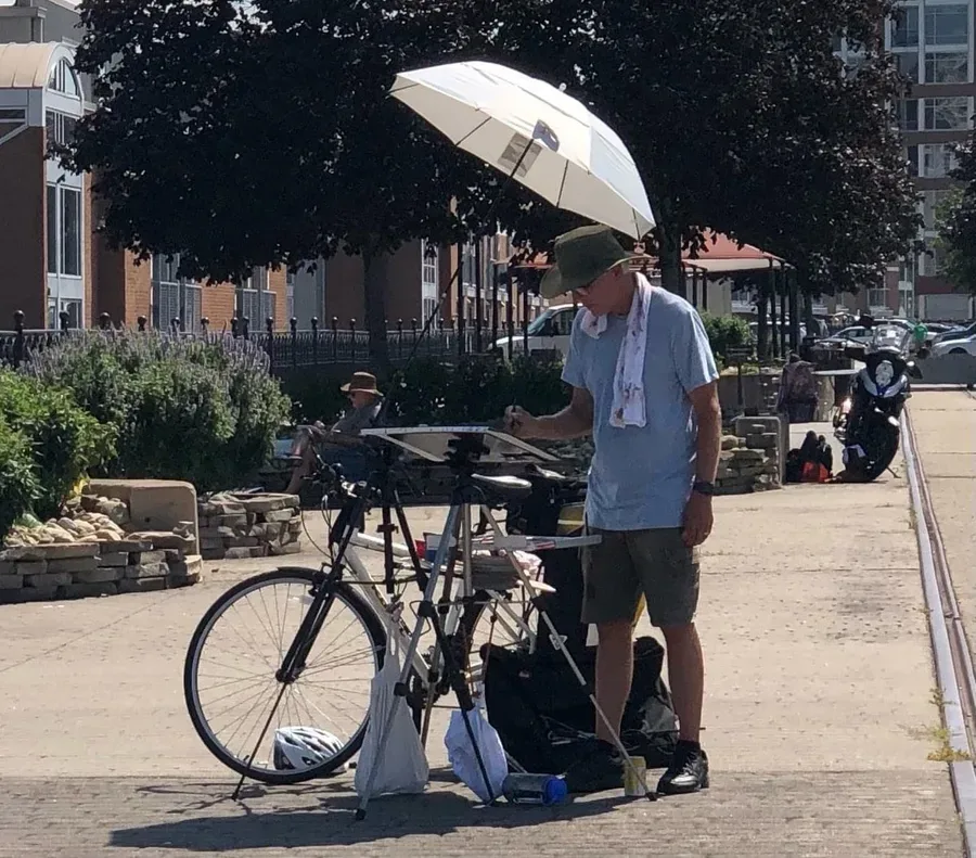 Plein air watercolorist Jeff Suntala painting with bicycle.