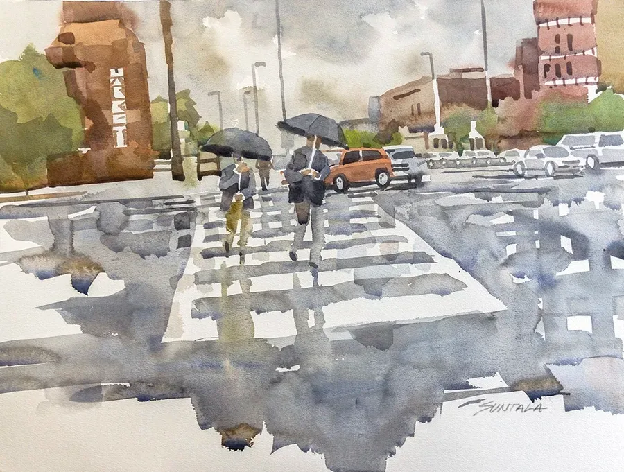 two men walking in rain with umbrellas
