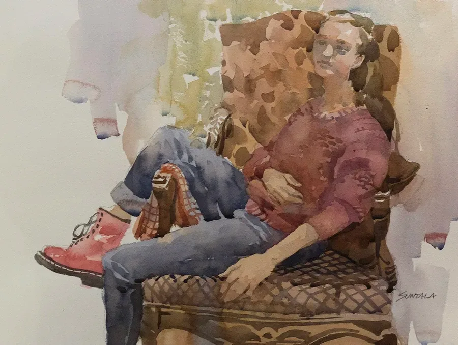 Watercolor of Cleveland area high school aged girl sitting semi reclined on floral arm chair with leg hanging over arm rest.