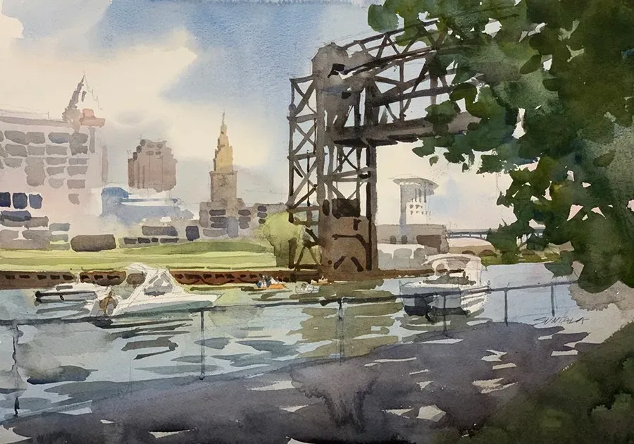 Cuyahoga River boat traffic with the Cleveland skyline in the distance.